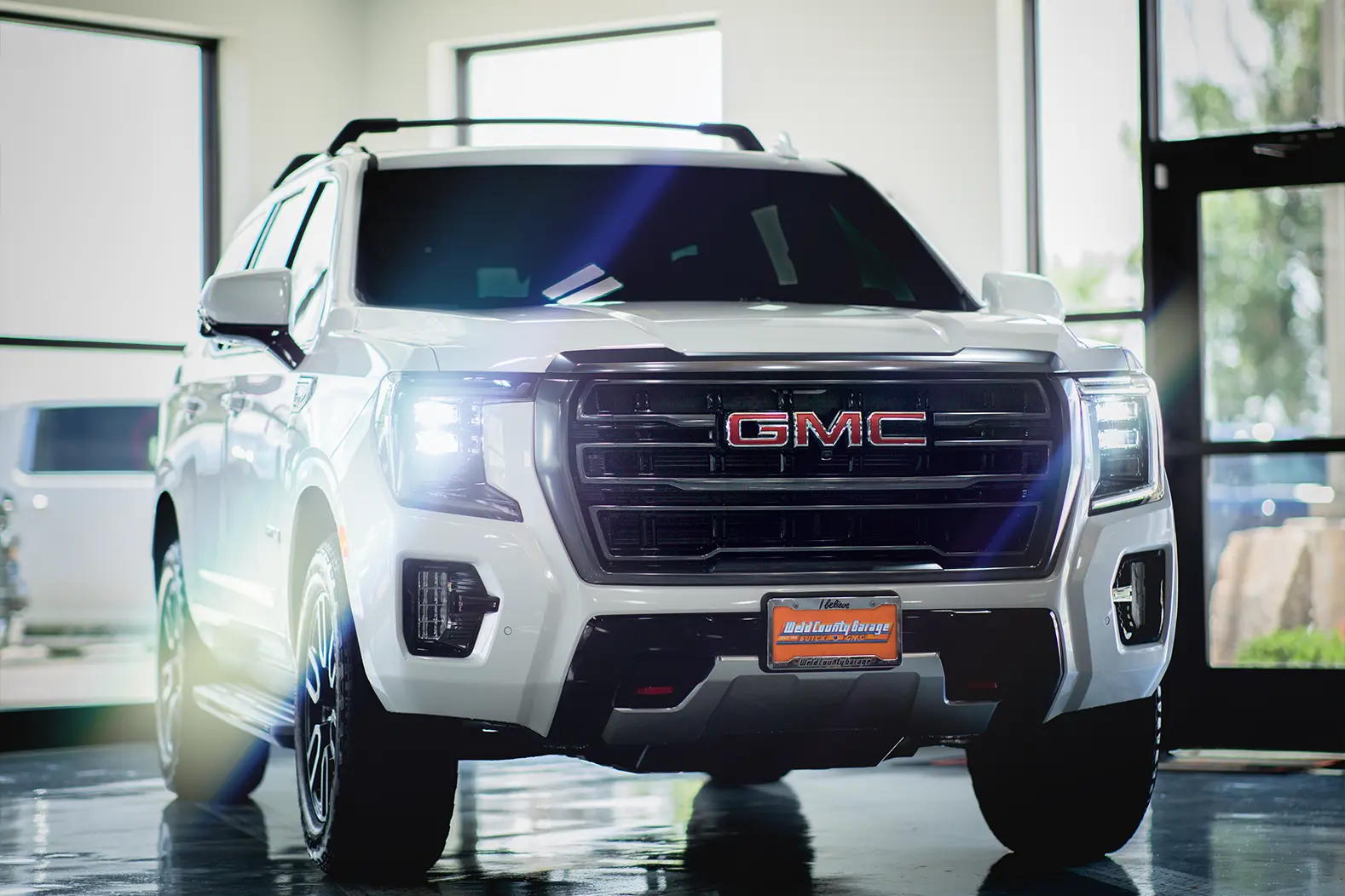 White Yukon at Weld County Garage Dealership