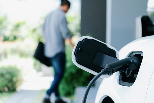 electric vehicle charging at station
