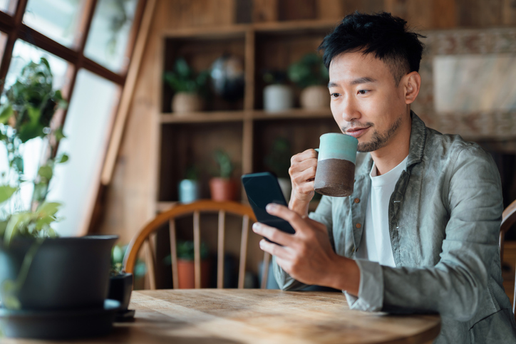 man watching phone screen